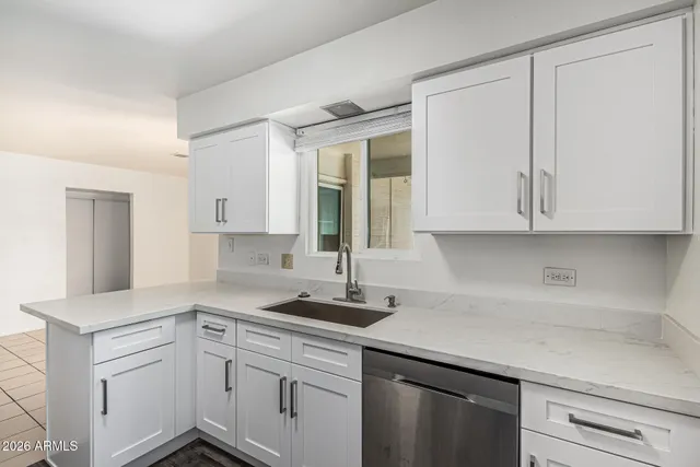 a kitchen with stainless steel appliances a refrigerator stove and microwave