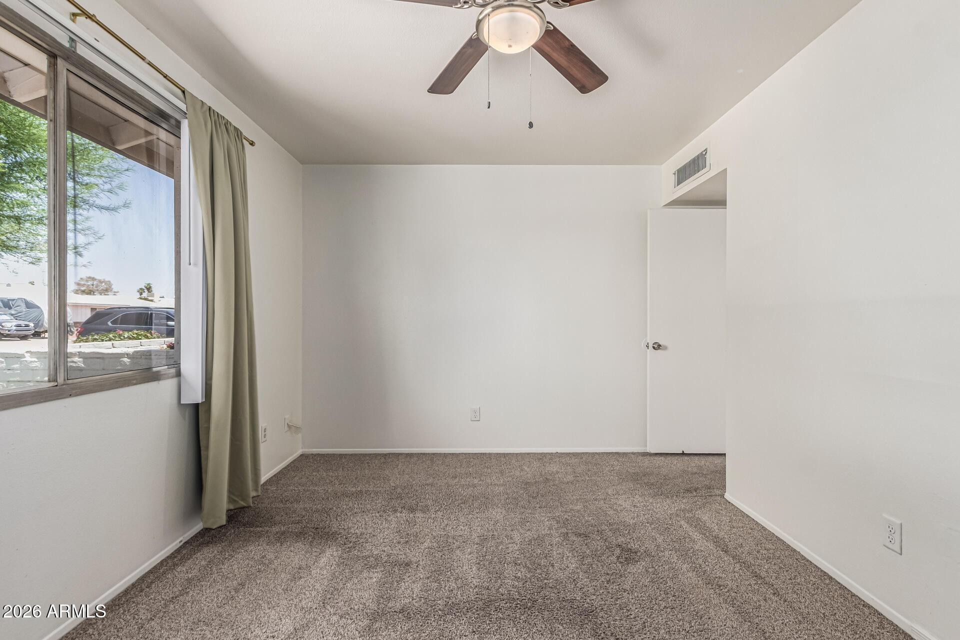 1213 East Riviera Drive Tempe, AZ 85282 - Photo 21 of 28 a view of a livingroom with a ceiling fan and window
