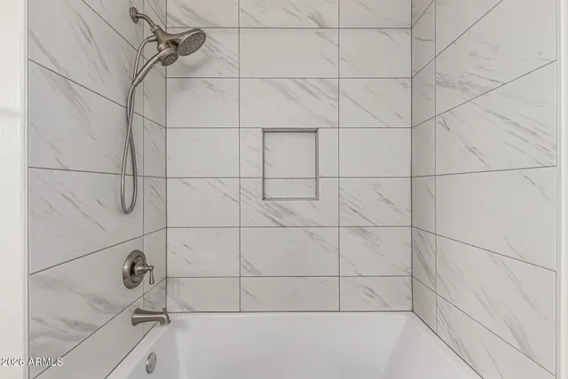 a view of storage and utility room with washer and dryer