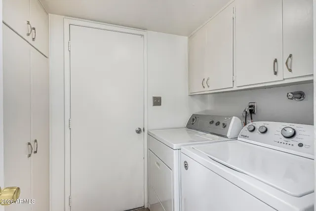 a view of a kitchen with a sink and cabinets