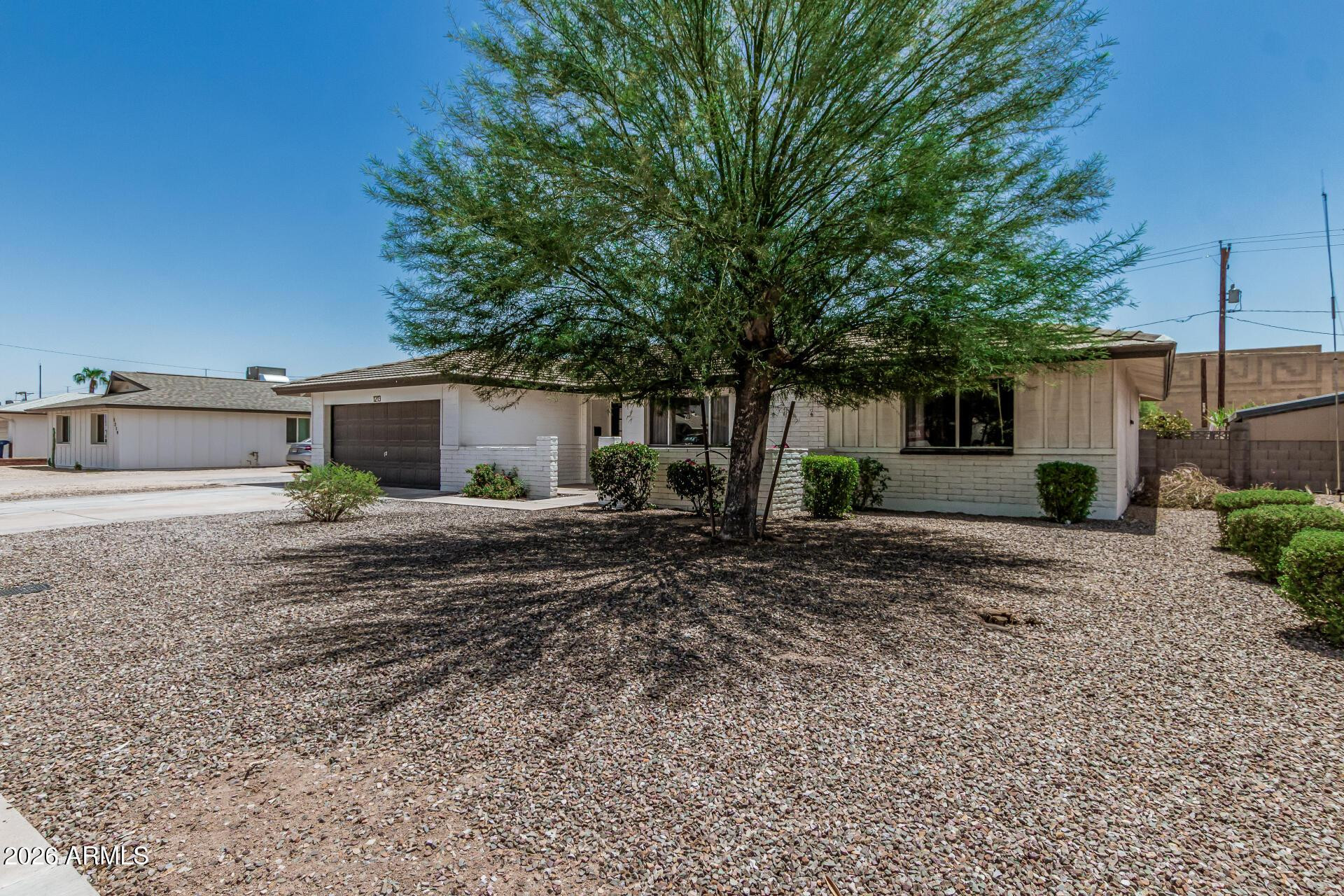 1213 East Riviera Drive Tempe, AZ 85282 - Photo 3 of 28 a view of a house with a yard