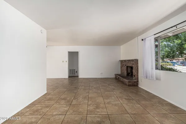 a view of livingroom with furniture and fireplace