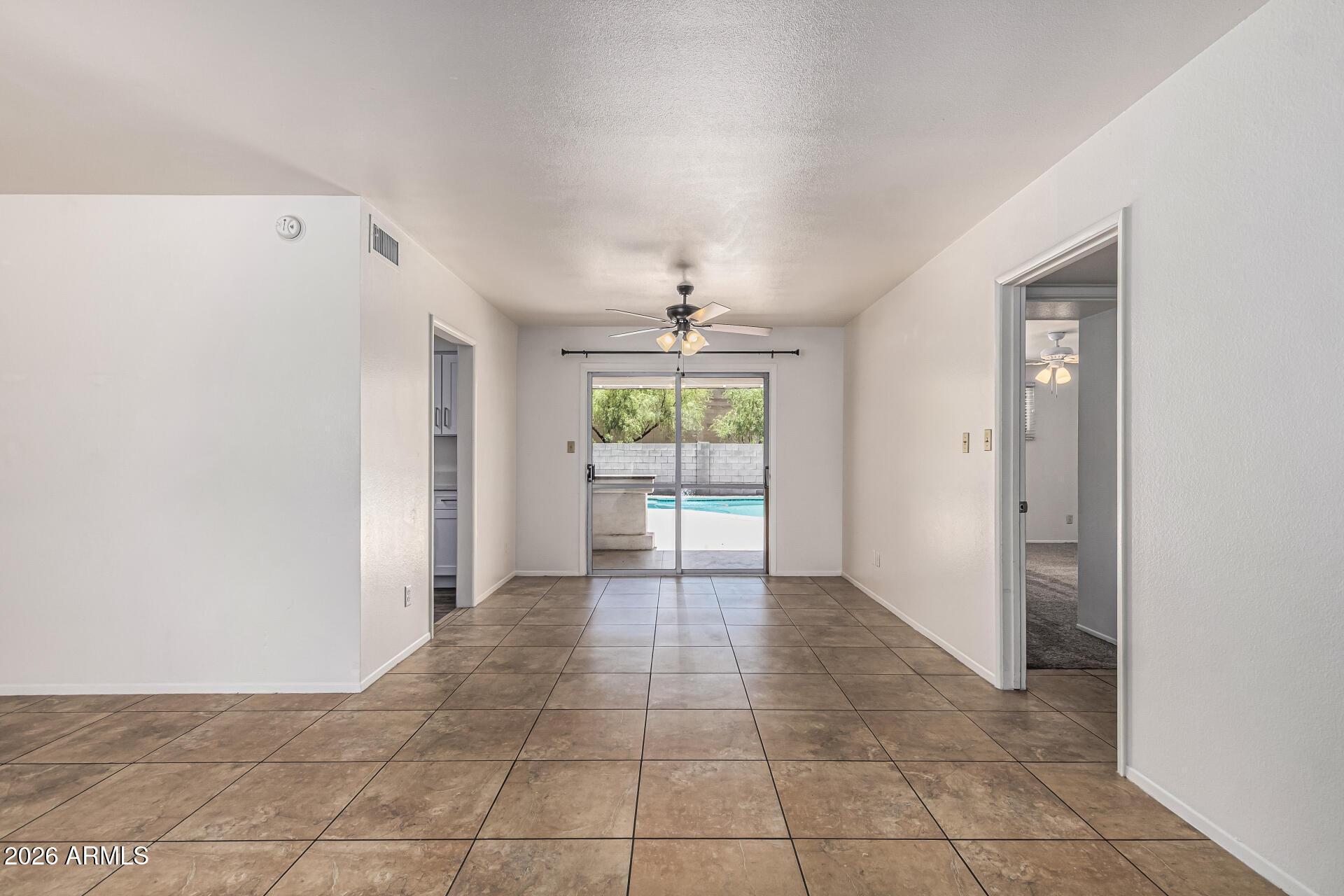 1213 East Riviera Drive Tempe, AZ 85282 - Photo 10 of 28 a view of an empty room with a window