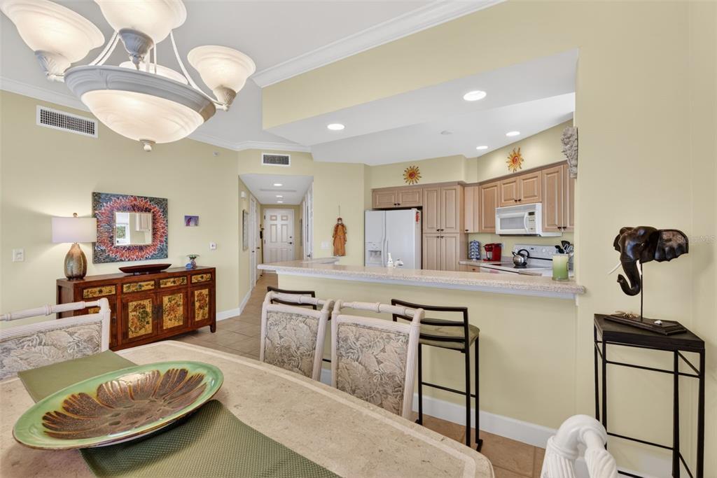 3191 Matecumbe Key Road, Unit 202 Punta Gorda, FL 33955 - Photo 13 of 37 a large kitchen with a table and chairs