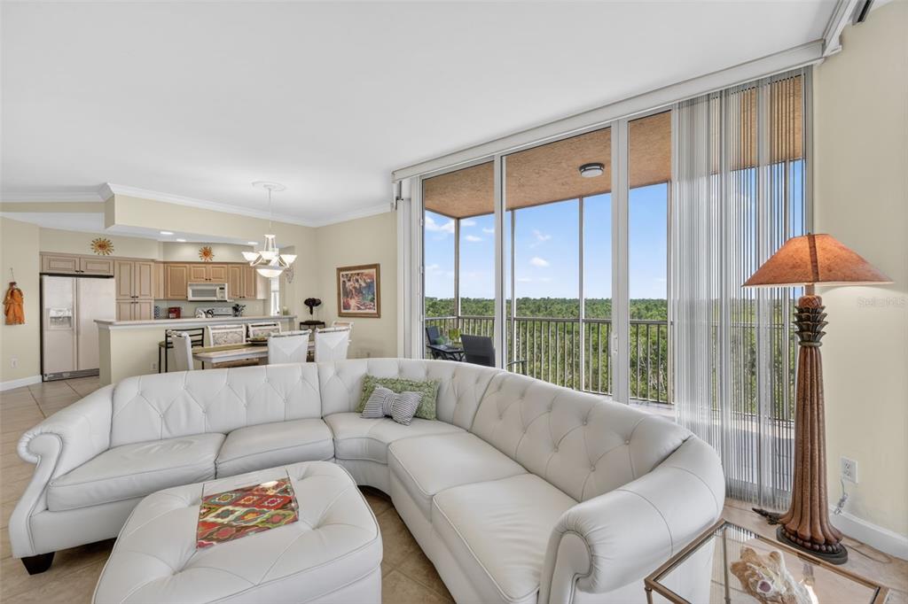 3191 Matecumbe Key Road, Unit 202 Punta Gorda, FL 33955 - Photo 14 of 37 a living room with furniture and a large window