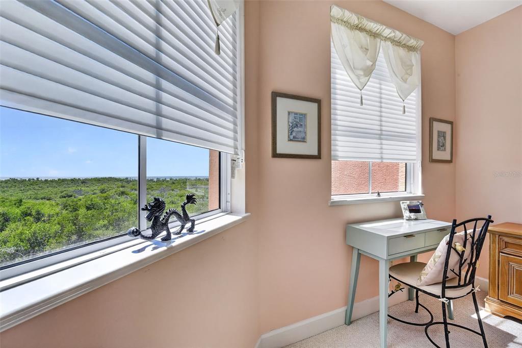 3191 Matecumbe Key Road, Unit 202 Punta Gorda, FL 33955 - Photo 17 of 37 a dining room with furniture and a floor to ceiling window next to a yard