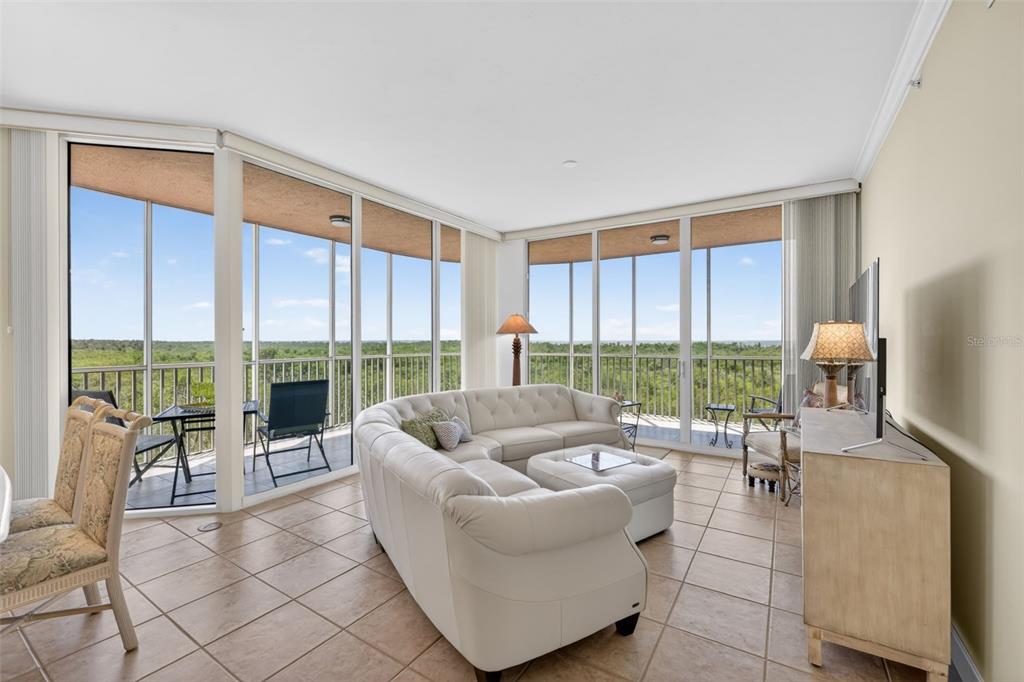 3191 Matecumbe Key Road, Unit 202 Punta Gorda, FL 33955 - Photo 2 of 37 a living room with furniture and a large window