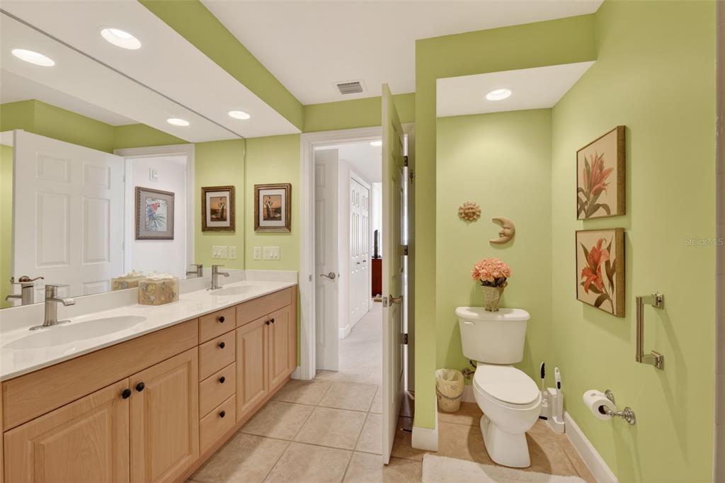 3191 Matecumbe Key Road, Unit 202 Punta Gorda, FL 33955 - Photo 21 of 37 a spacious bathroom with a granite countertop sink toilet and shower