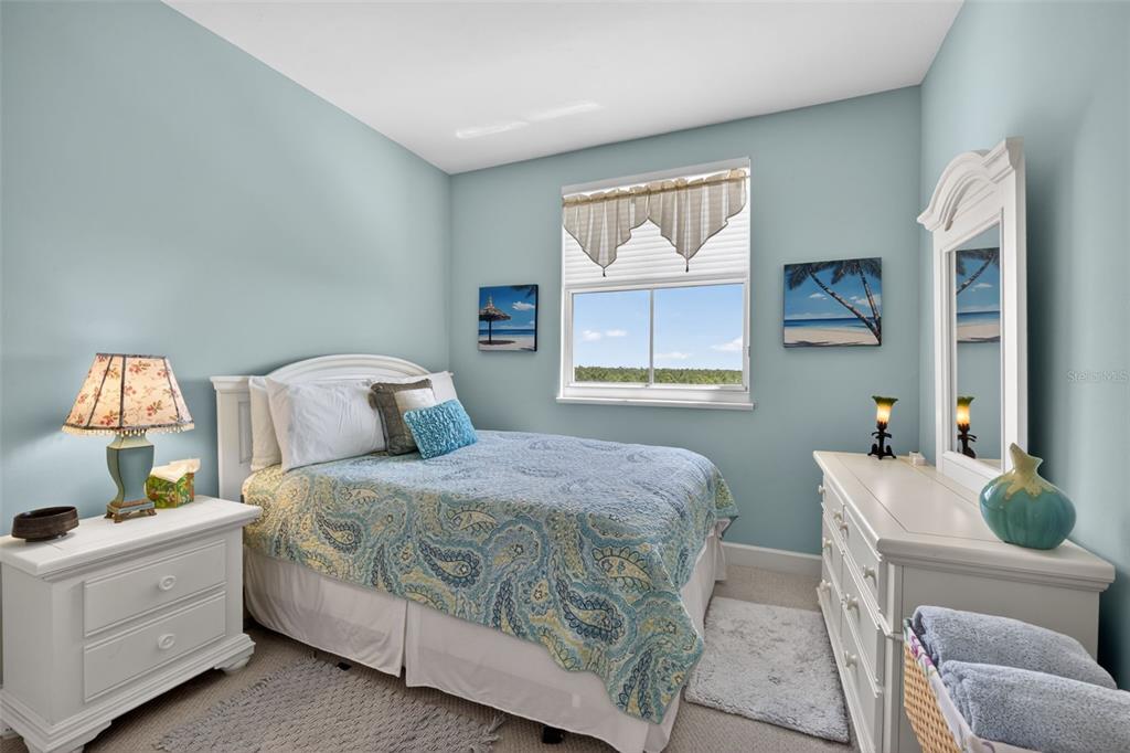 3191 Matecumbe Key Road, Unit 202 Punta Gorda, FL 33955 - Photo 24 of 37 a bedroom with a bed and a window