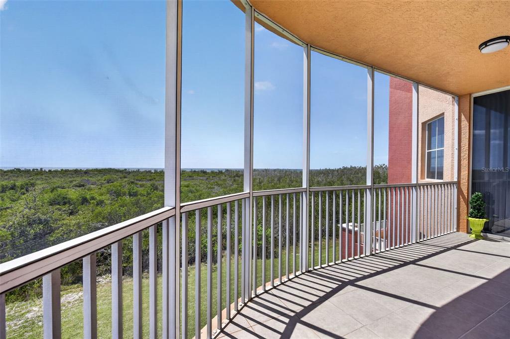 3191 Matecumbe Key Road, Unit 202 Punta Gorda, FL 33955 - Photo 30 of 37 a view of a balcony with yard