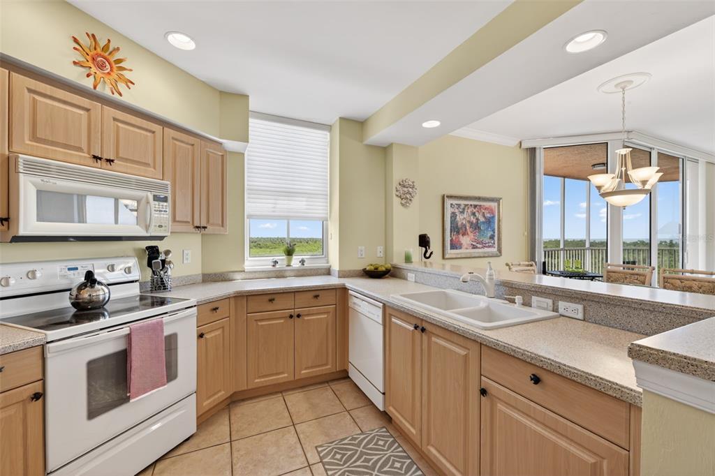 3191 Matecumbe Key Road, Unit 202 Punta Gorda, FL 33955 - Photo 9 of 37 a kitchen with a sink stove and cabinets