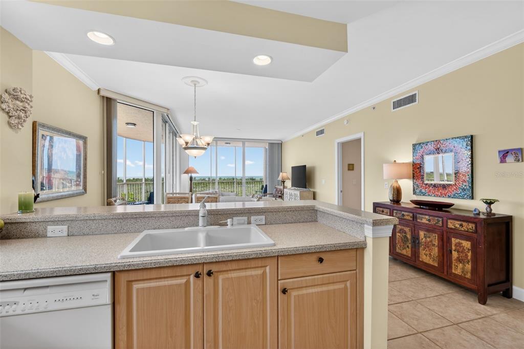 3191 Matecumbe Key Road, Unit 202 Punta Gorda, FL 33955 - Photo 10 of 37 a kitchen with stainless steel appliances granite countertop a sink and a stove