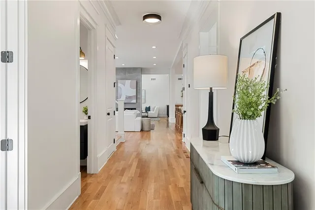 a view of living room filled with furniture and wooden floor