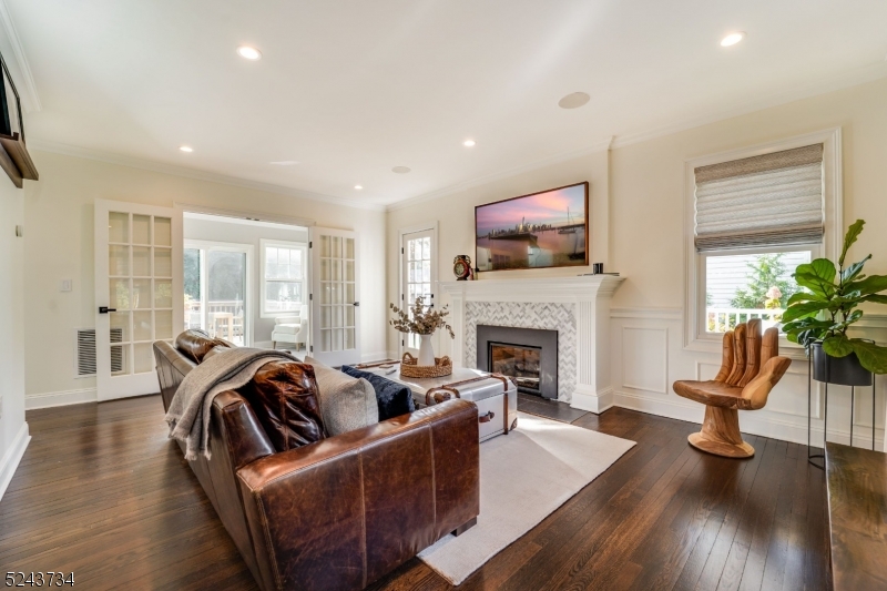 2 Loantaka Way Madison, NJ 07940 - Photo 11 of 50 a living room with furniture fireplace and flat screen tv