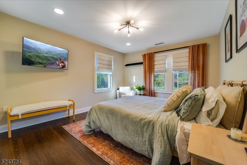 2 Loantaka Way Madison, NJ 07940 - Photo 27 of 50 a bedroom with a bed and a flat screen tv