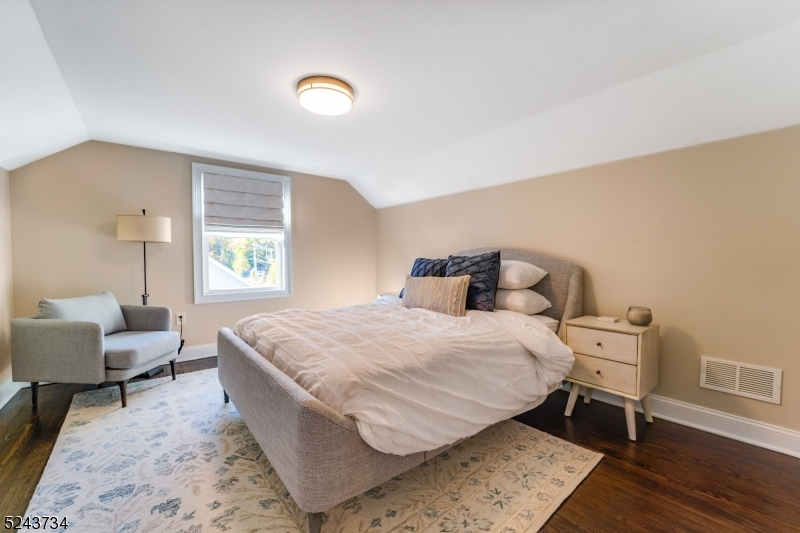 2 Loantaka Way Madison, NJ 07940 - Photo 33 of 50 a bedroom with a bed and wooden floor