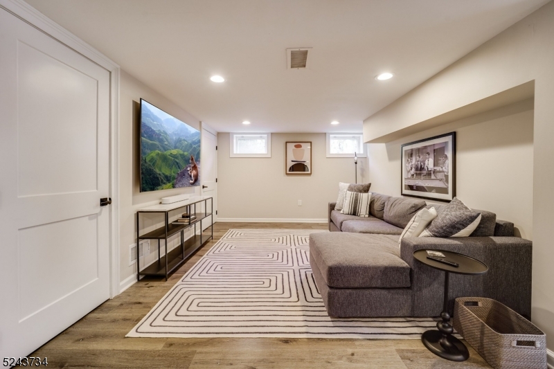 2 Loantaka Way Madison, NJ 07940 - Photo 45 of 50 a bedroom with furniture and a flat screen tv