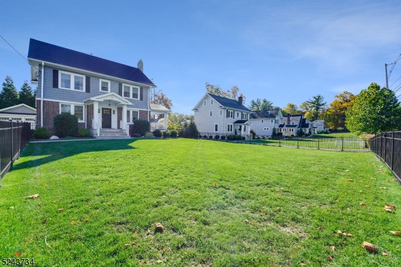 2 Loantaka Way Madison, NJ 07940 - Photo 46 of 50 a view of a house with a big yard and palm trees
