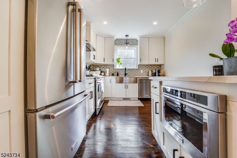 2 Loantaka Way Madison, NJ 07940 - Photo 5 of 50 a kitchen with stainless steel appliances a stove top oven and a refrigerator
