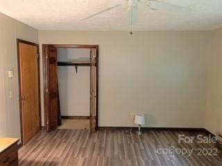 154 Meadows Road Canton, NC 28716 - Photo 24 of 31 an empty room with wooden floor and a window
