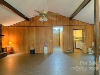 154 Meadows Road Canton, NC 28716 - Photo 9 of 31 a view of a livingroom with wooden floor and a ceiling fan