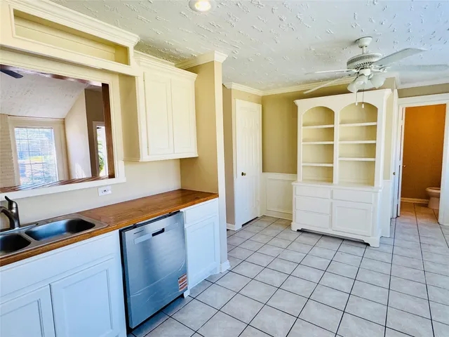 a view of a bathroom with a sink and a mirror