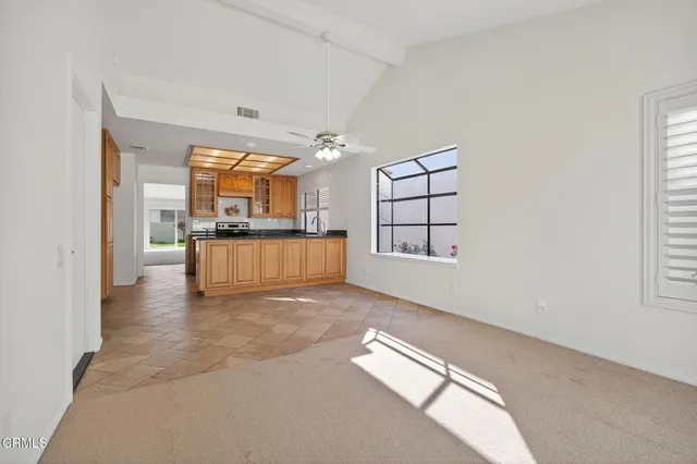 a view of a livingroom with furniture and windows