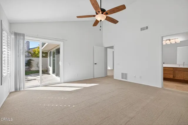 a view of livingroom with hardwood floor and a ceiling fan