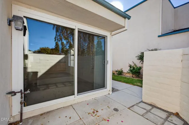 a view of a door and a window