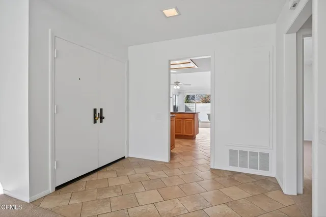 a view of a livingroom and a hallway