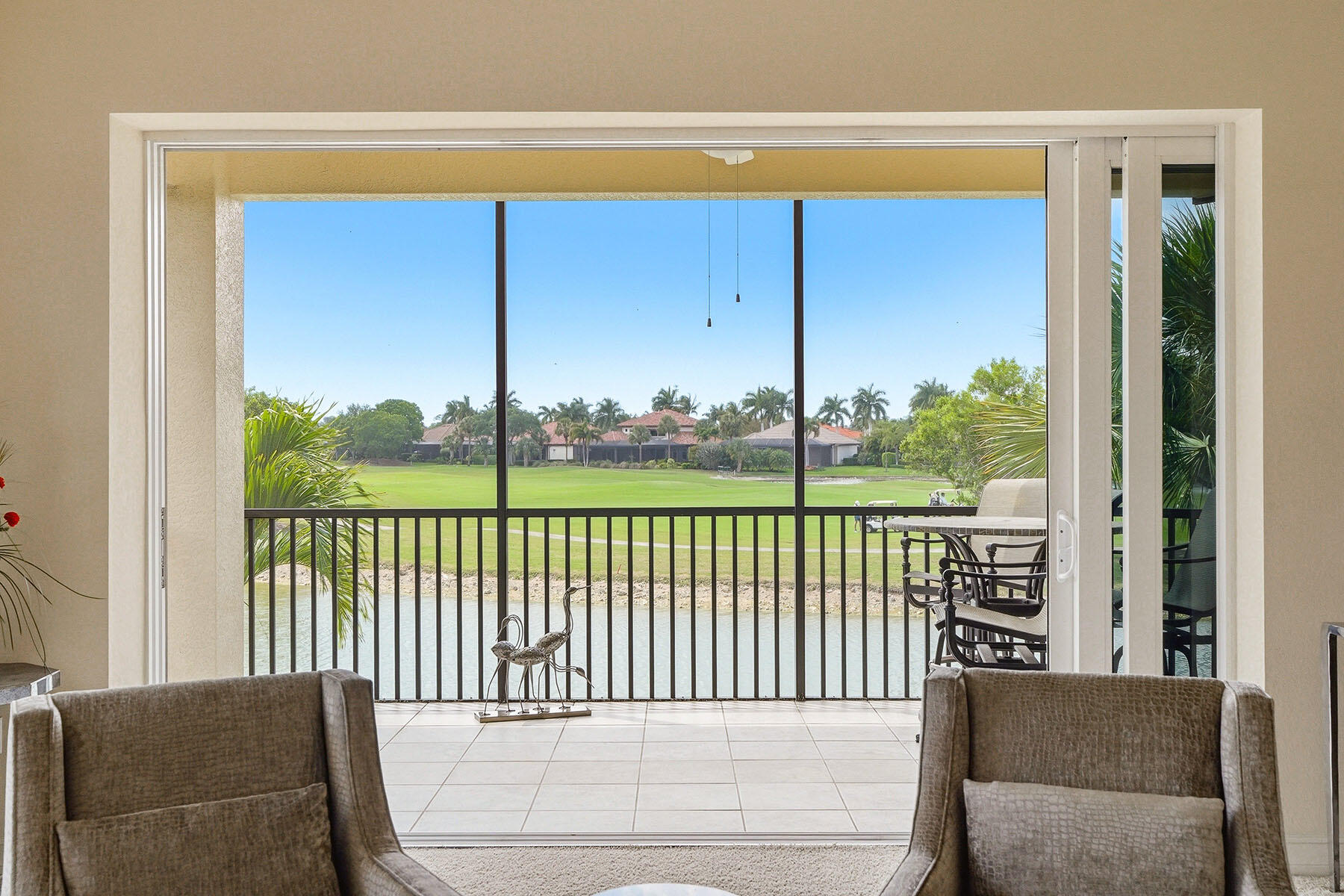 8605 Champions Point, Unit 103 Naples, FL 34113 - Photo 22 of 44 a balcony view with a couch