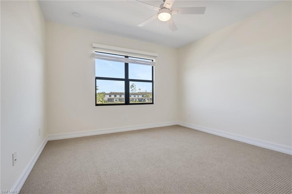 7540 Carnegie Way Naples, FL 34119 - Photo 13 of 40 an empty room with a window