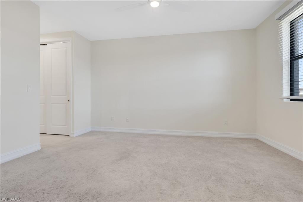 7540 Carnegie Way Naples, FL 34119 - Photo 26 of 40 a view of an empty room and window