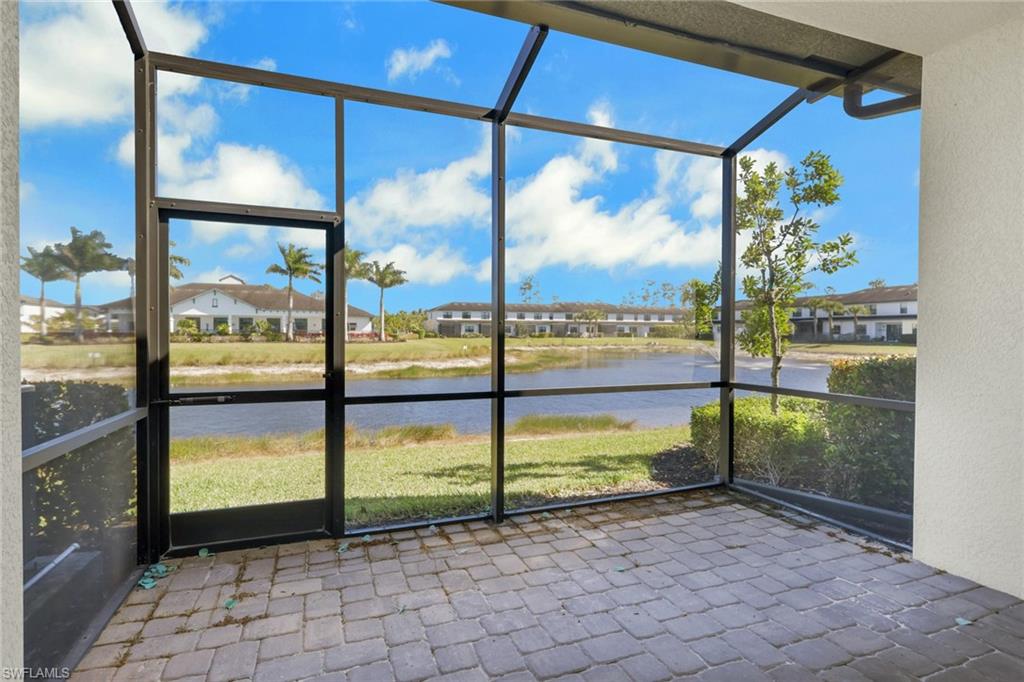 7540 Carnegie Way Naples, FL 34119 - Photo 7 of 40 a view of a from a room with a floor to ceiling window