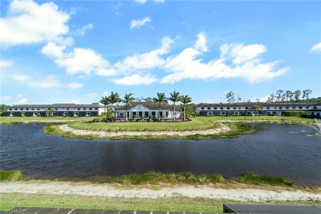7540 Carnegie Way Naples, FL 34119 - Photo 8 of 40 a view of a swimming pool and lake view