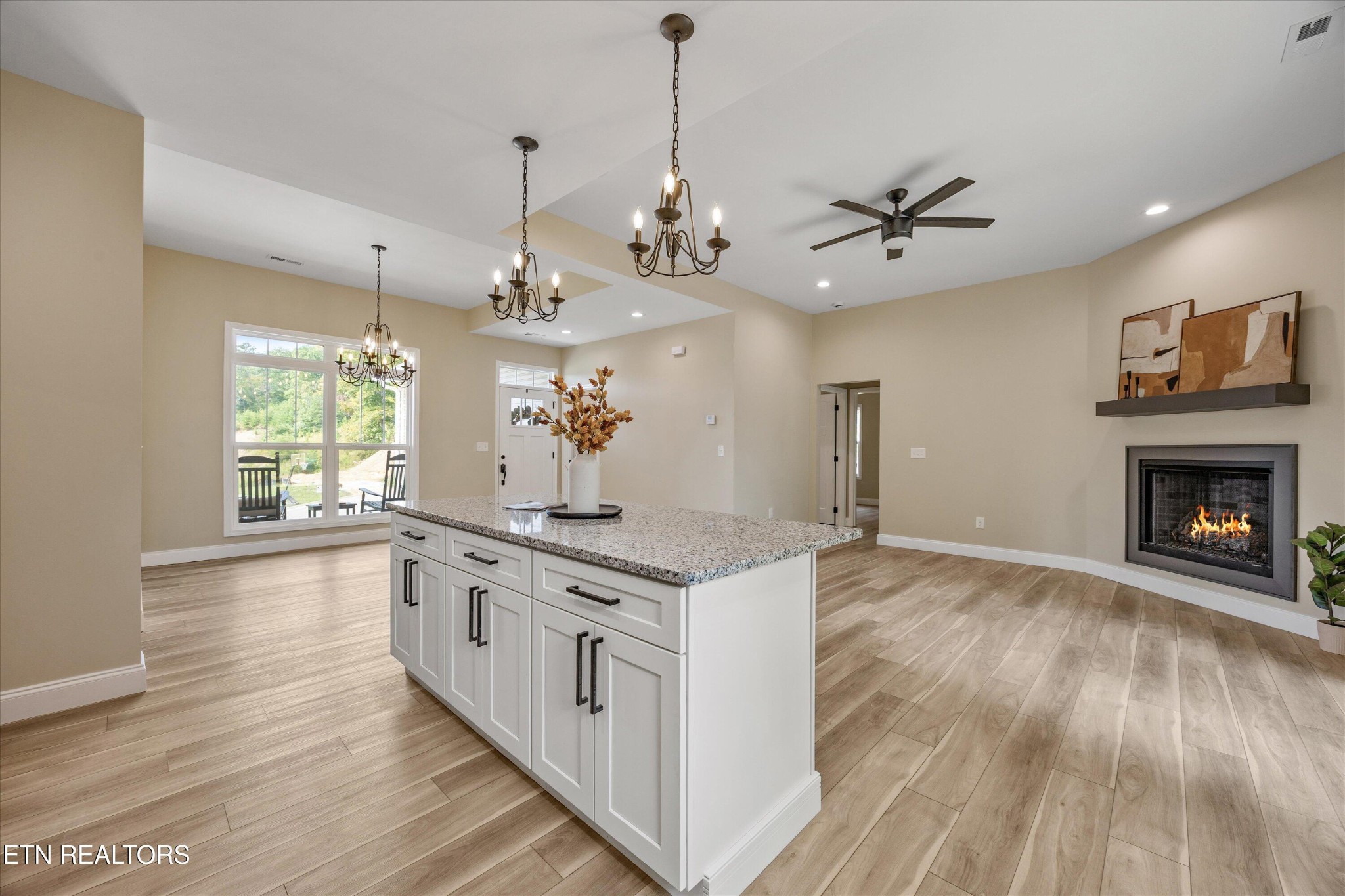 210 Daniel Morris Point Clinton, TN 37716 - Photo 13 of 45 a kitchen with stainless steel appliances granite countertop a stove and a wooden floor