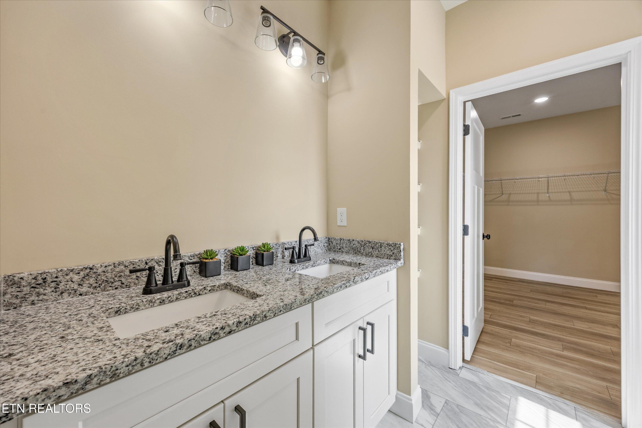 210 Daniel Morris Point Clinton, TN 37716 - Photo 27 of 45 a bathroom with a granite countertop sink and a mirror