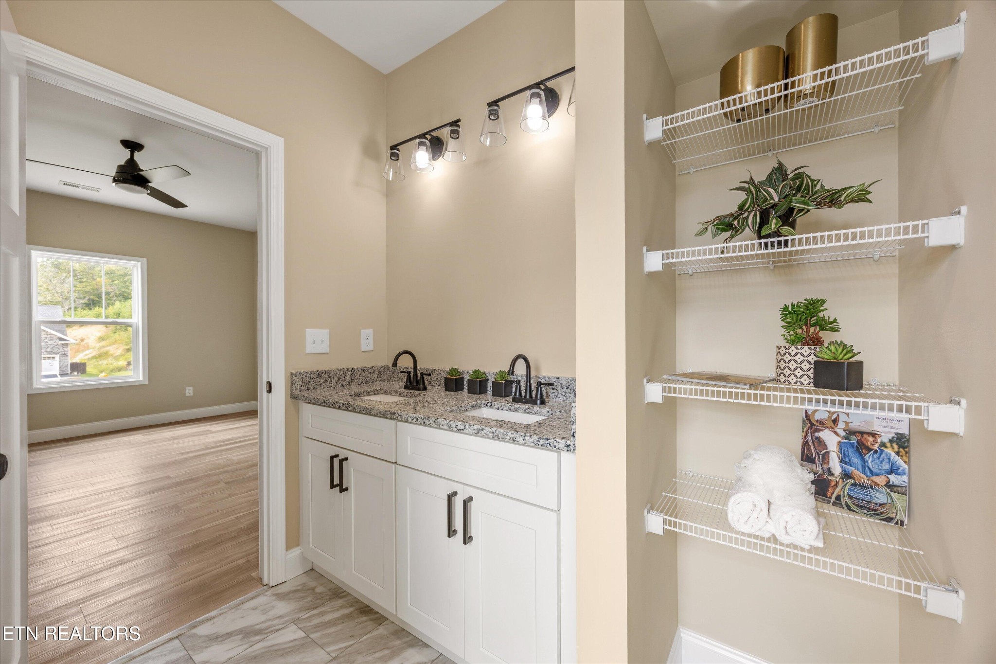 210 Daniel Morris Point Clinton, TN 37716 - Photo 30 of 45 a bathroom with a granite countertop sink and a mirror