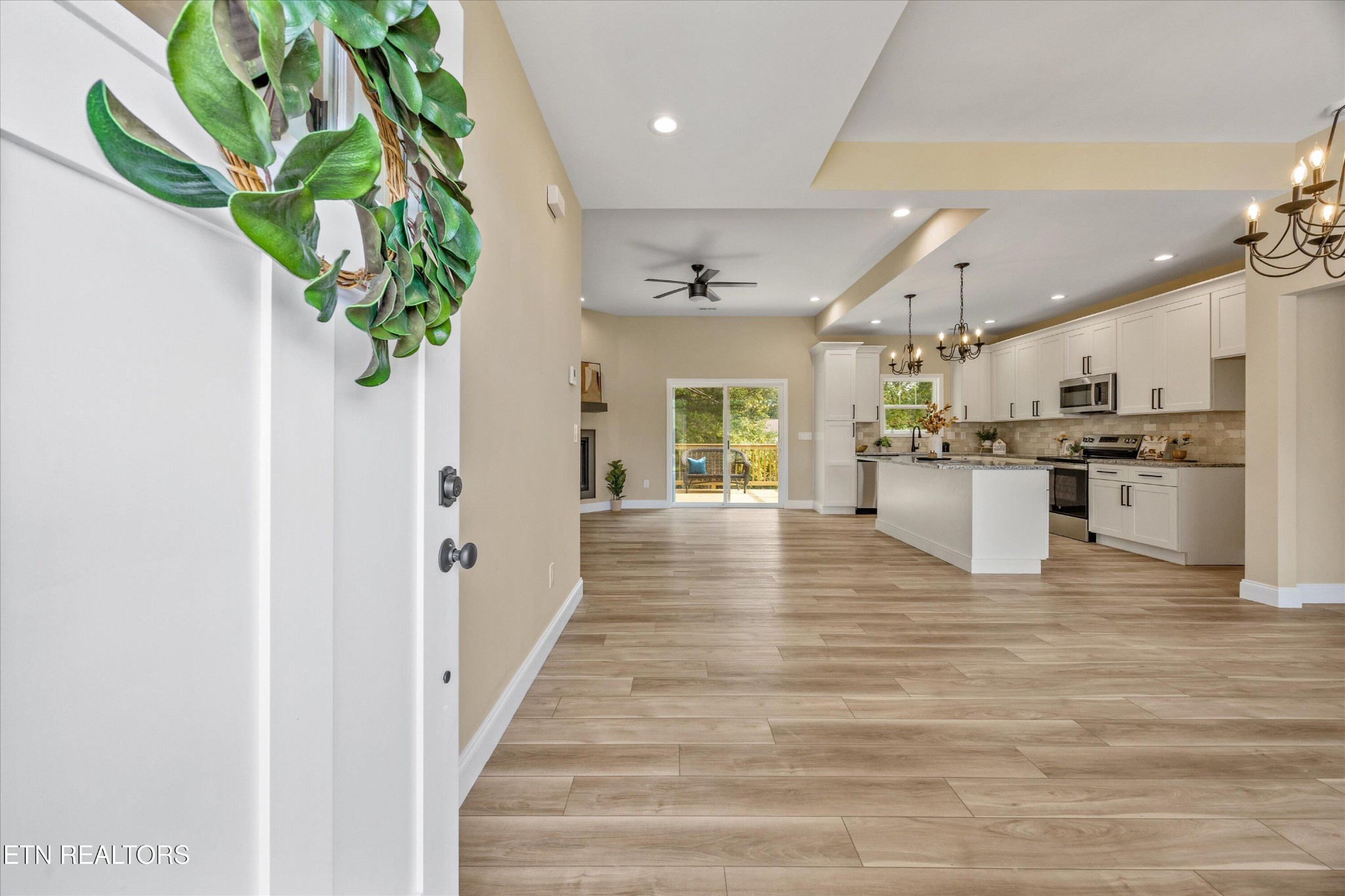 210 Daniel Morris Point Clinton, TN 37716 - Photo 3 of 45 a view of kitchen with cabinets and wooden floor