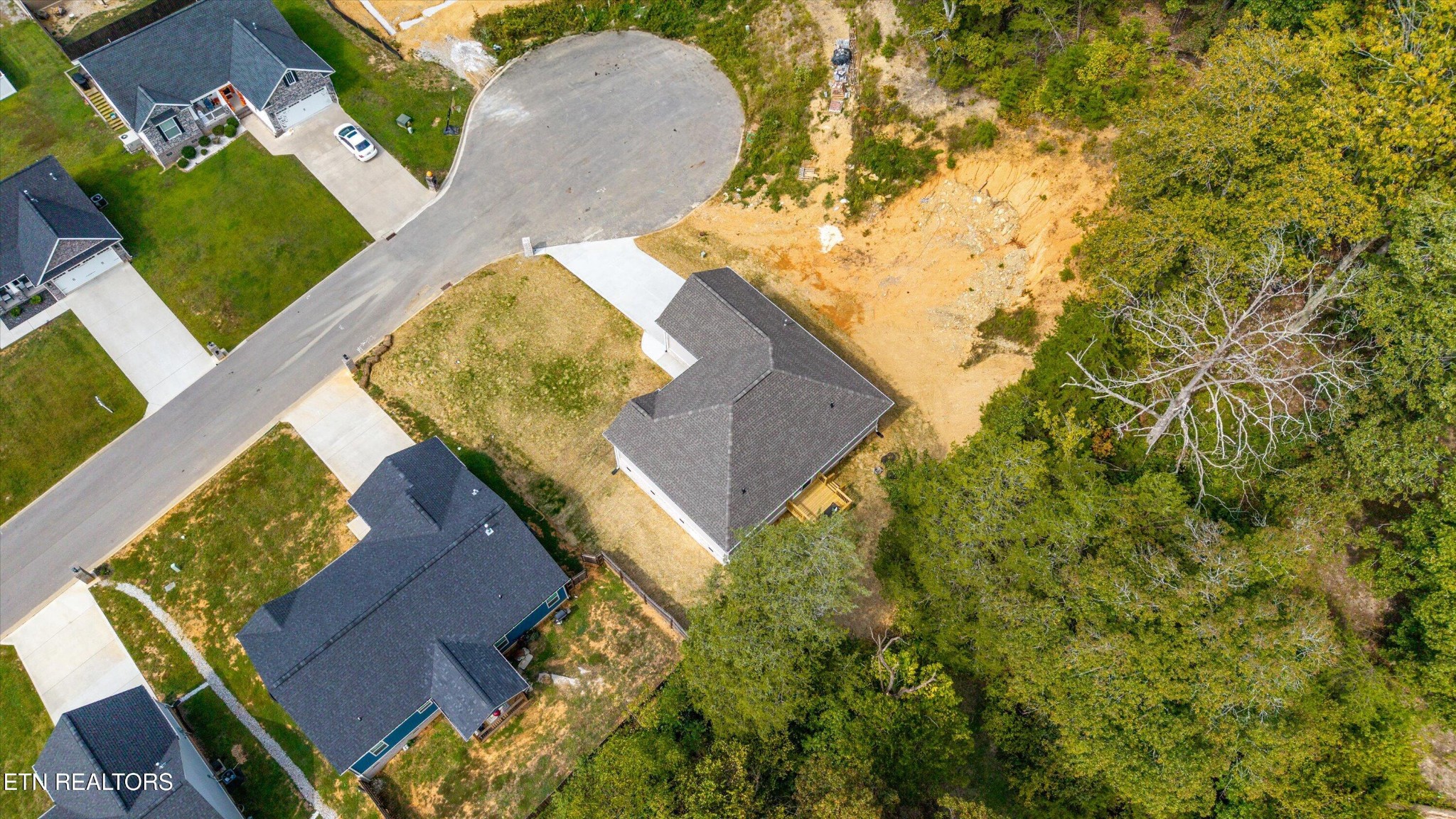 210 Daniel Morris Point Clinton, TN 37716 - Photo 36 of 45 an aerial view of a house with a yard and wooden fence