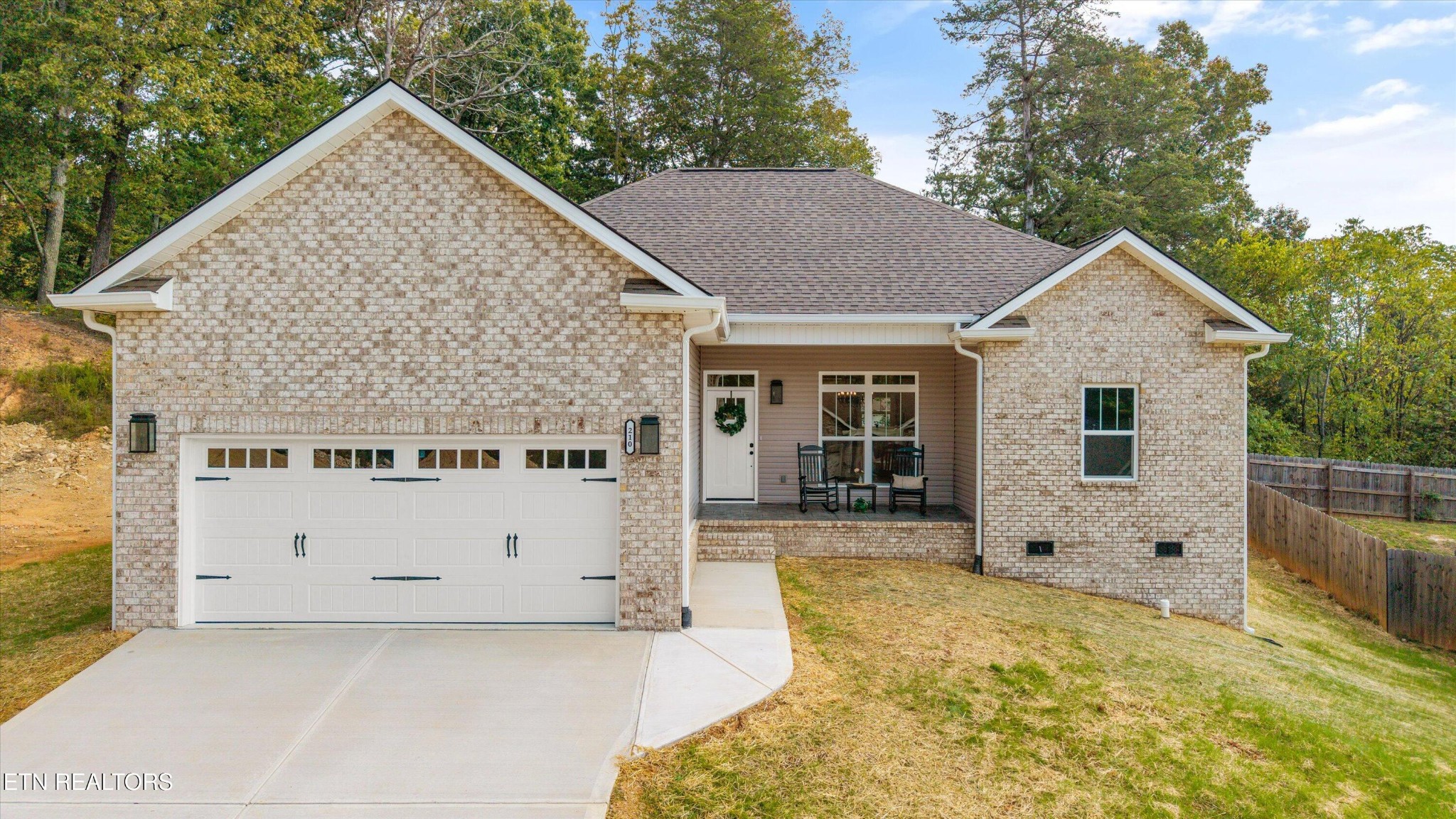 210 Daniel Morris Point Clinton, TN 37716 - Photo 41 of 45 a view of house and yard with trees in the background