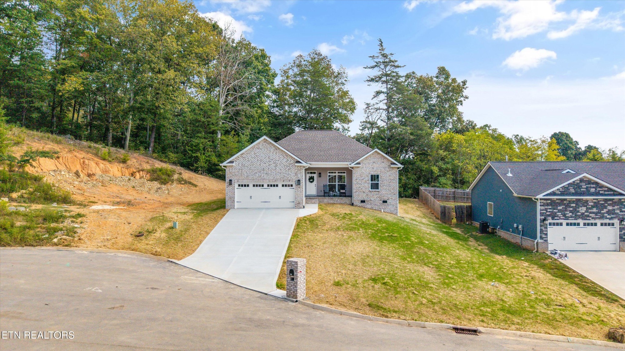210 Daniel Morris Point Clinton, TN 37716 - Photo 42 of 45 a front view of a house with a yard