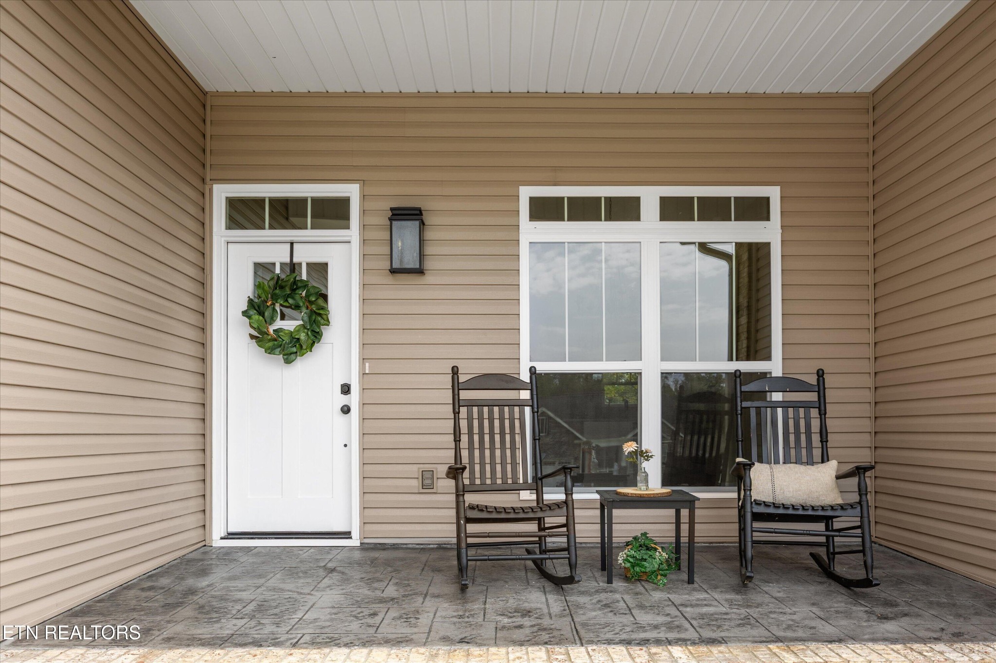 210 Daniel Morris Point Clinton, TN 37716 - Photo 44 of 45 a view of a patio with a chairs and table in a patio