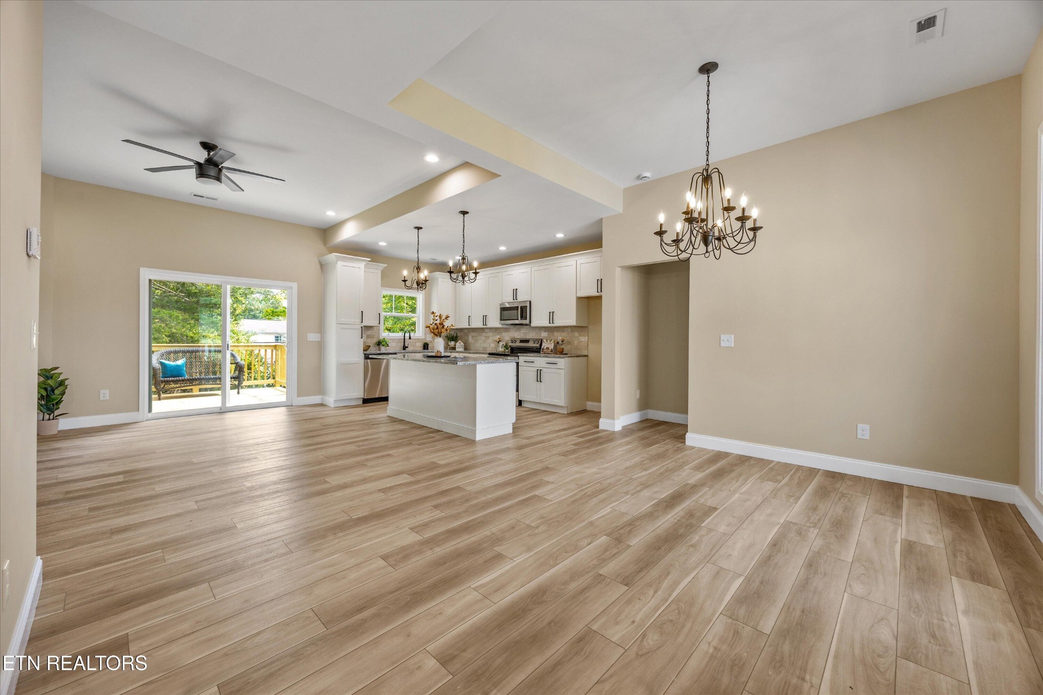 210 Daniel Morris Point Clinton, TN 37716 - Photo 5 of 45 a view of a livingroom with a furniture wooden floor a chandelier