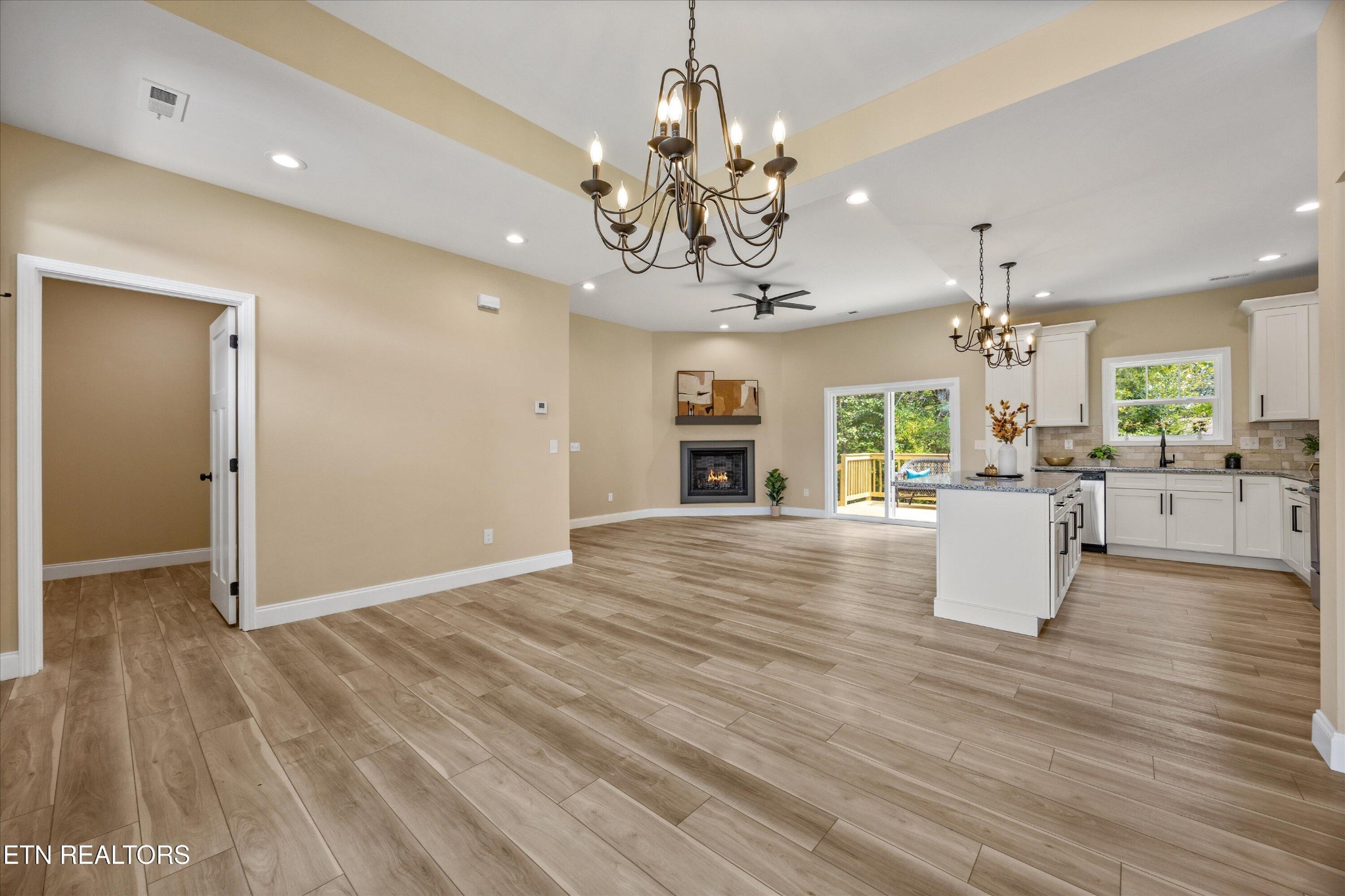 210 Daniel Morris Point Clinton, TN 37716 - Photo 7 of 45 an empty room with kitchen and chandelier