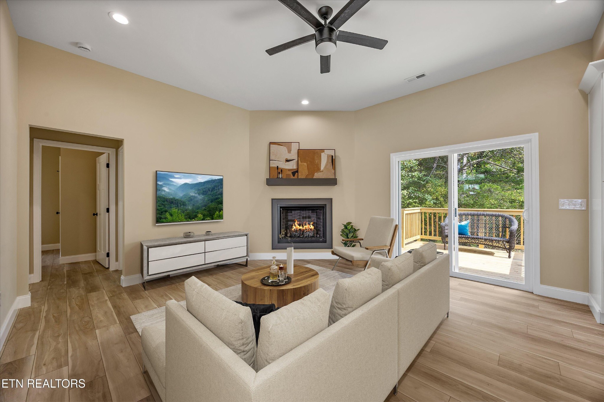 210 Daniel Morris Point Clinton, TN 37716 - Photo 9 of 45 a living room with furniture and a fireplace