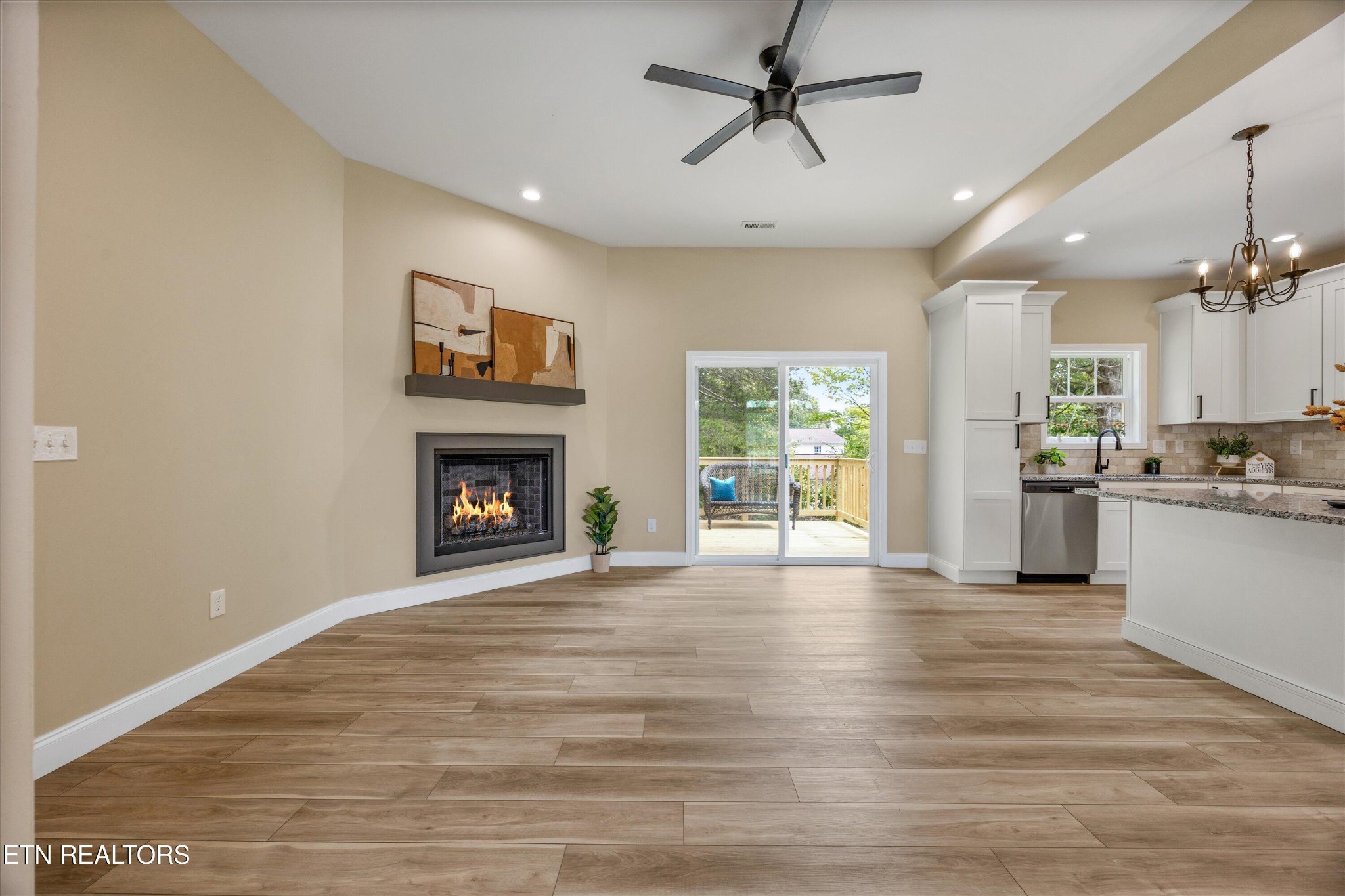 210 Daniel Morris Point Clinton, TN 37716 - Photo 10 of 45 a view of an empty room with a fireplace and a window