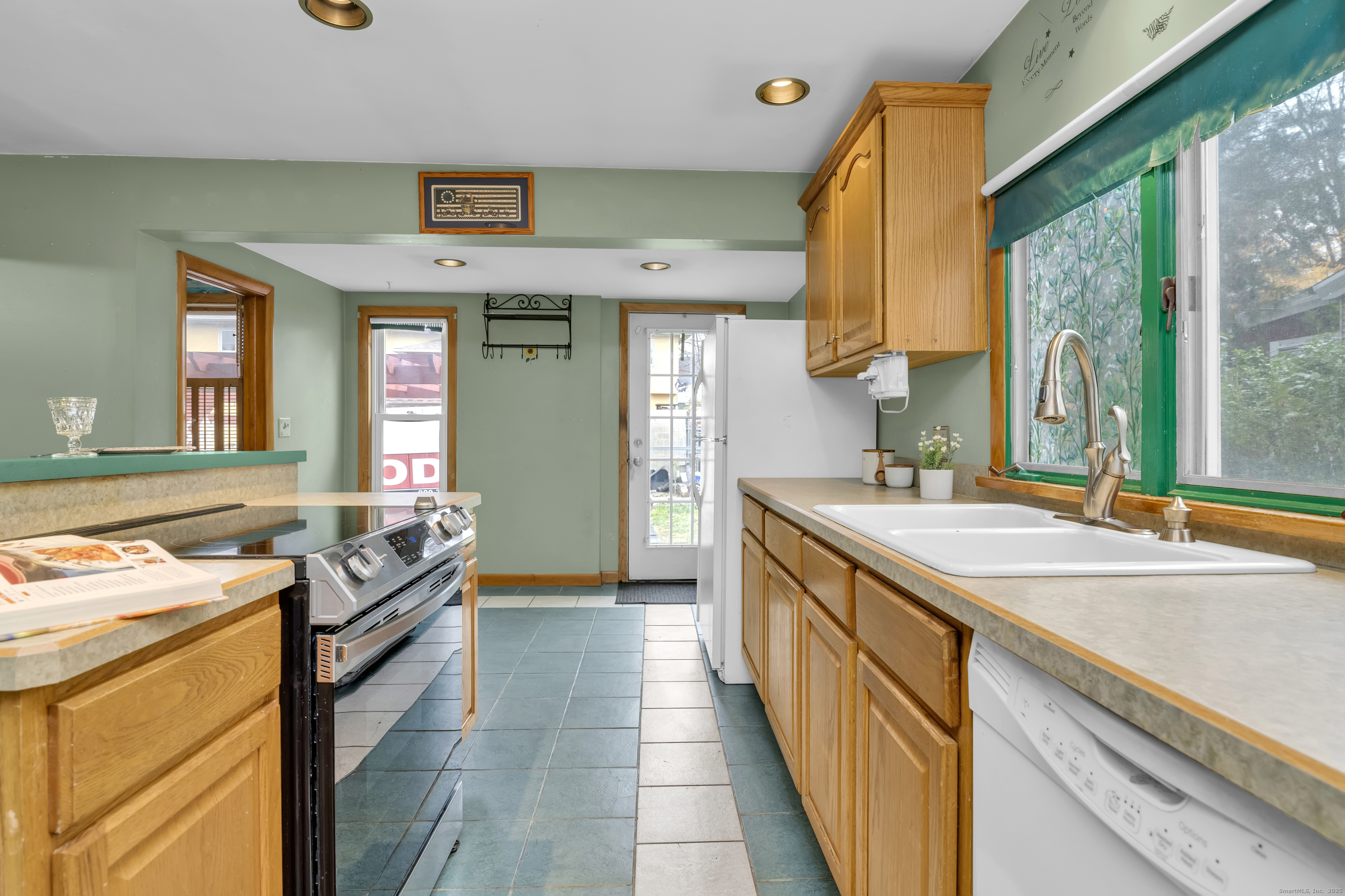 22 Lewis Street Naugatuck, CT 06770 - Photo 11 of 31 a kitchen with a sink stove and cabinets