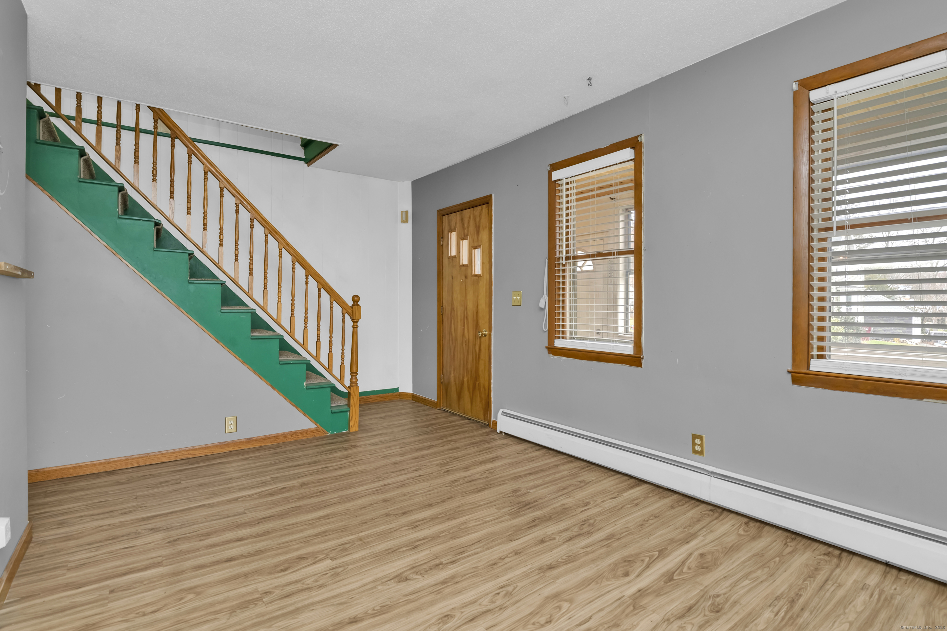 22 Lewis Street Naugatuck, CT 06770 - Photo 14 of 31 a view of an entryway with wooden floor and stairs