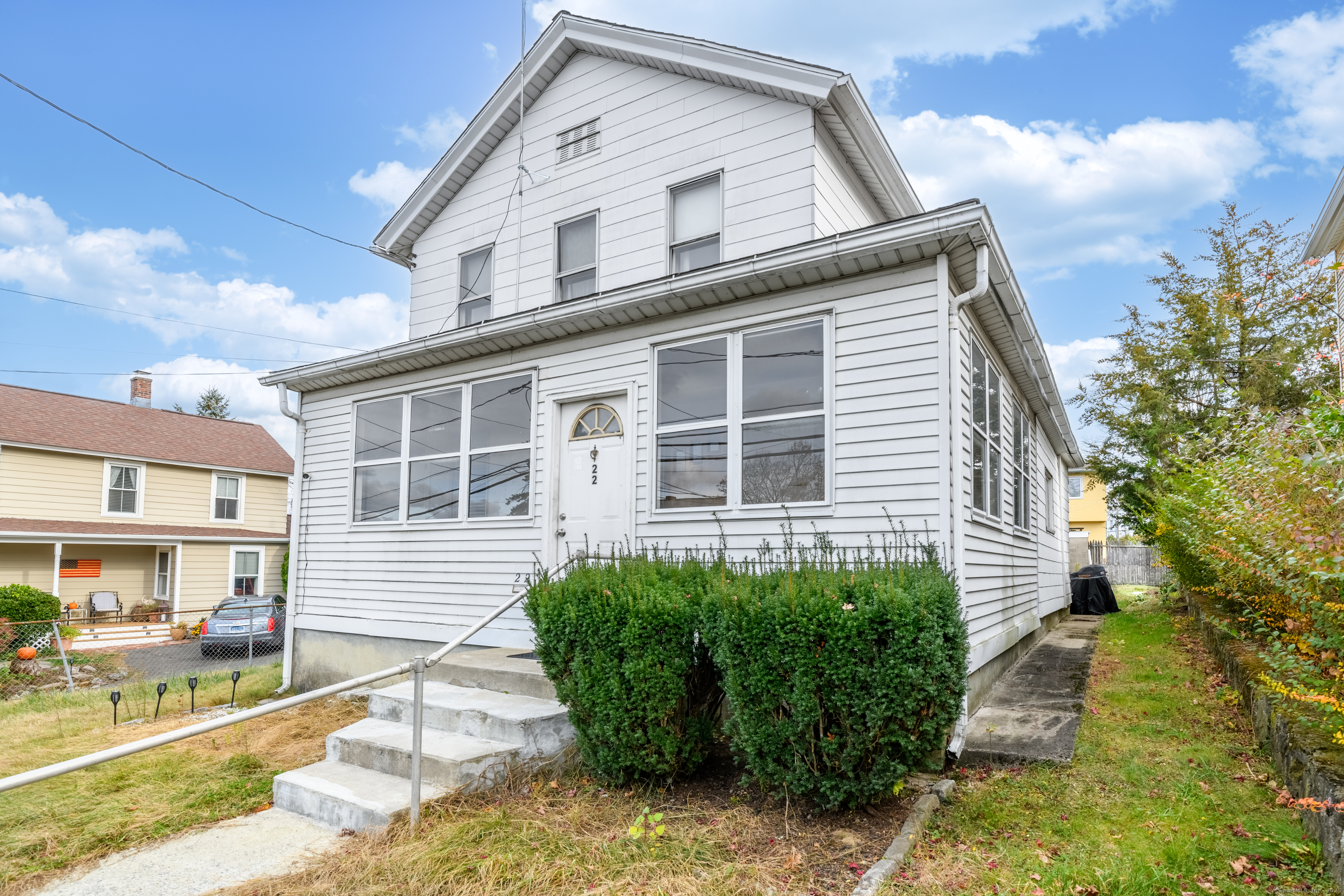 22 Lewis Street Naugatuck, CT 06770 - Photo 2 of 31 a front view of a house with a yard